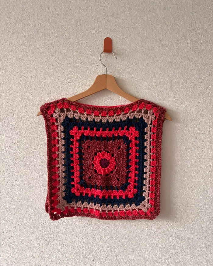 The Circus vest hanging on a wall, one side