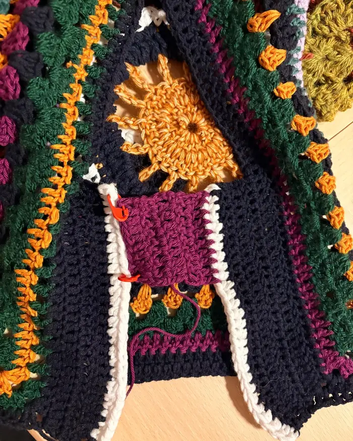 Closeup of the vest's stitch and colour blocks