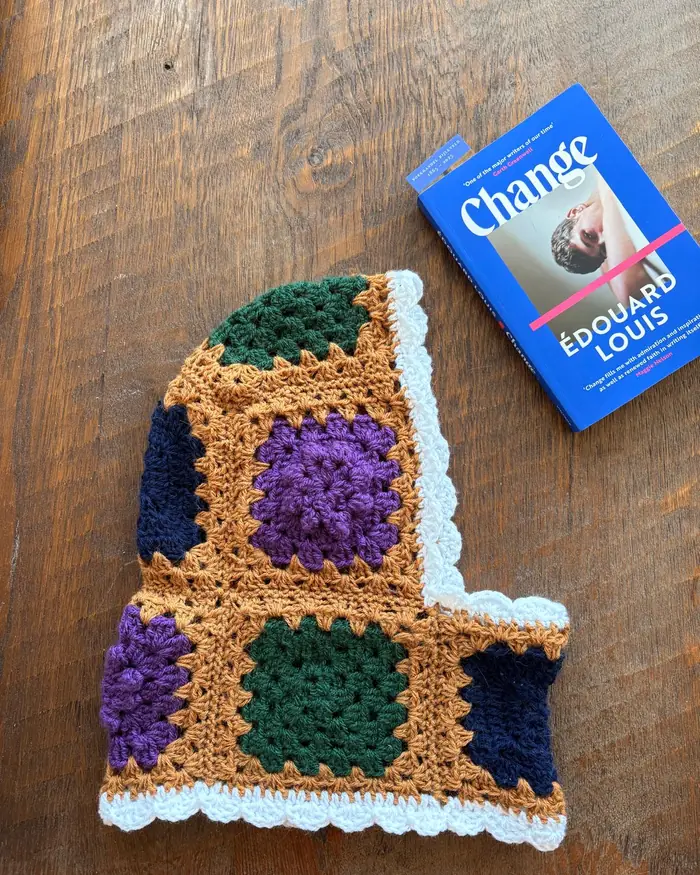 Crochet piece laid flat on a wooden table