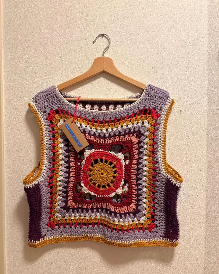 The Fuga vest hanging on a wall, one side